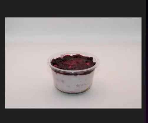 Berry yogurt parfait cup with mixed berry compote
