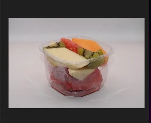 Fresh fruit salad cup with kiwi, watermelon and pineapple