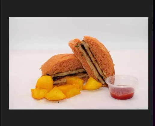 Grilled sandwich with potato wedges and ketchup