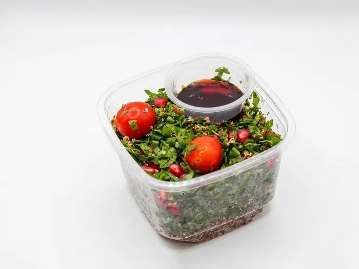 Herbed Quinoa & Pomegranate Salad — Healthy Version, Olaya, Al Khobar Chopped herb and quinoa salad with pomegranate, cherry tomato and tahini dressing